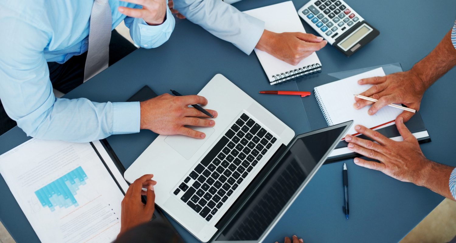 Cropped image of group of businesspeople working together in office - Consulting